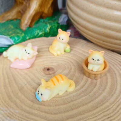 Handcrafted cat laying and playing miniature for fairy gardens